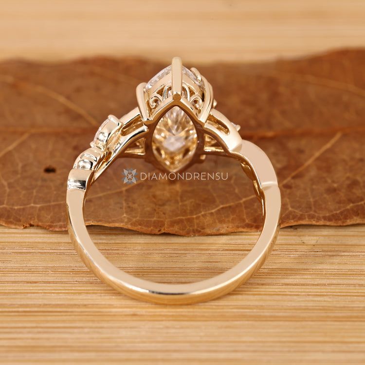 Marquise diamond ring with blooming flower bud setting.