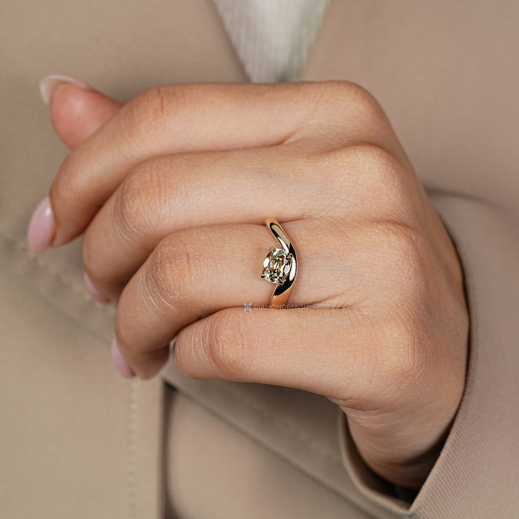 East to west solitaire ring with tapered shank.