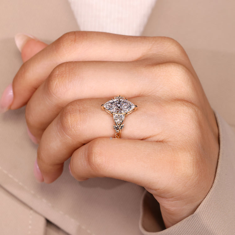 Seven stone marquise ring with round side stones.