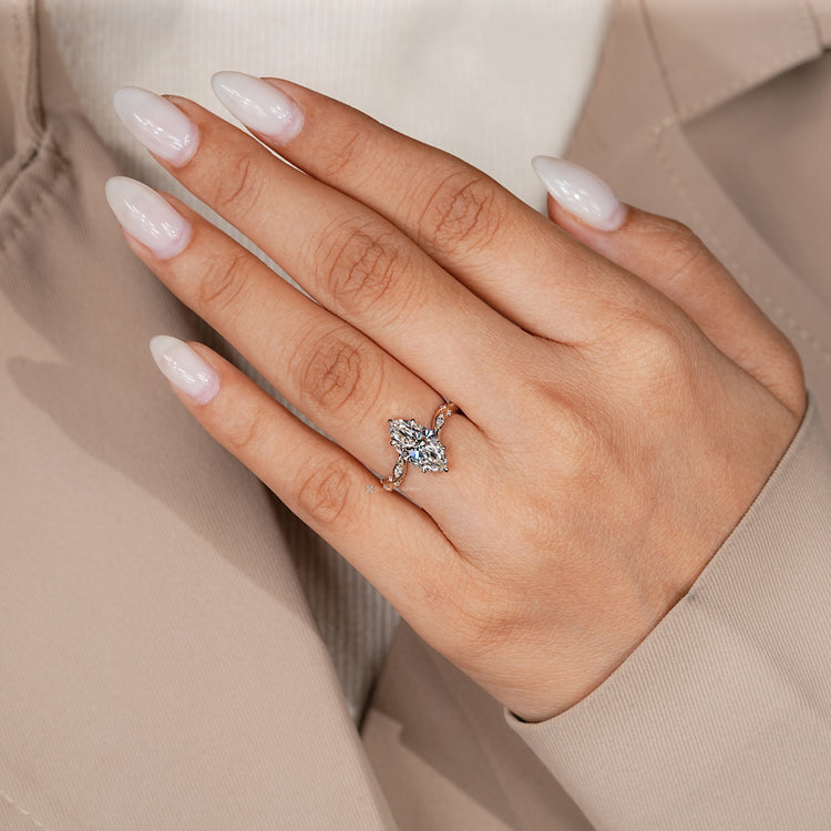 Handmade bypass setting ring with marquise centre diamond.