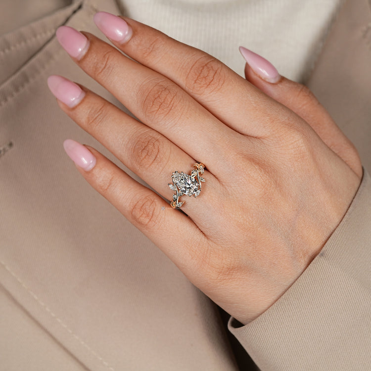 Nature inspired diamond ring with five claw prongs.