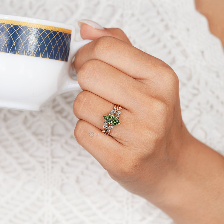 Marquise engagement ring with cluster setting design.