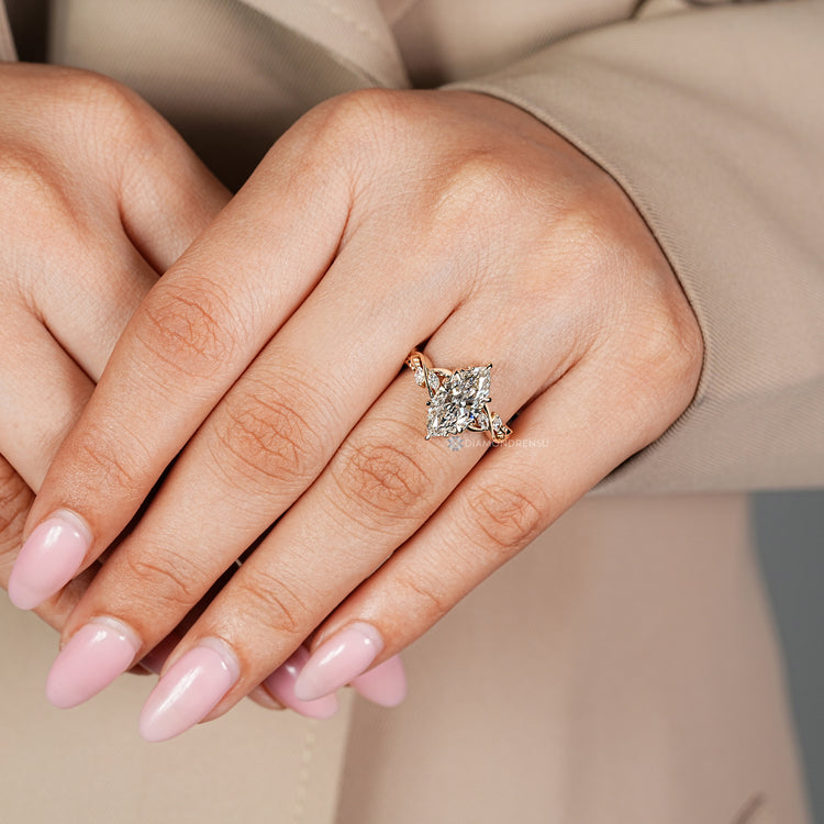 Nature inspired ring with marquise side stones.