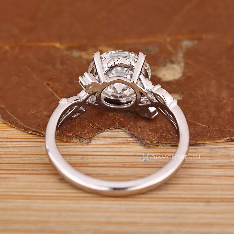 Nature inspired diamond ring with marquise side stones.