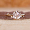 Round cut diamond ring in yellow gold.