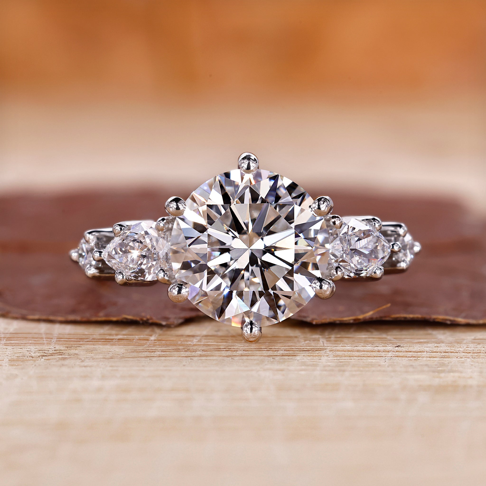 5 stone diamond ring with round and pear shaped diamonds.
