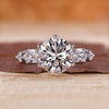 5 stone diamond ring with round and pear shaped diamonds.
