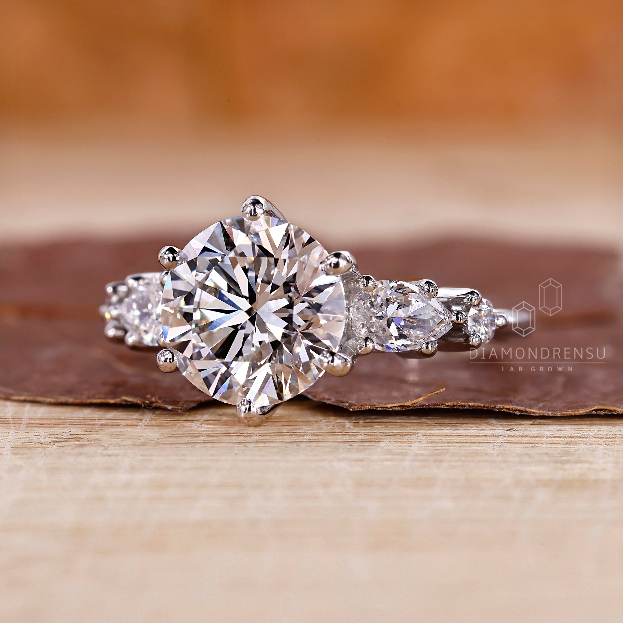 Pear side stones ring in a five stone layout.
