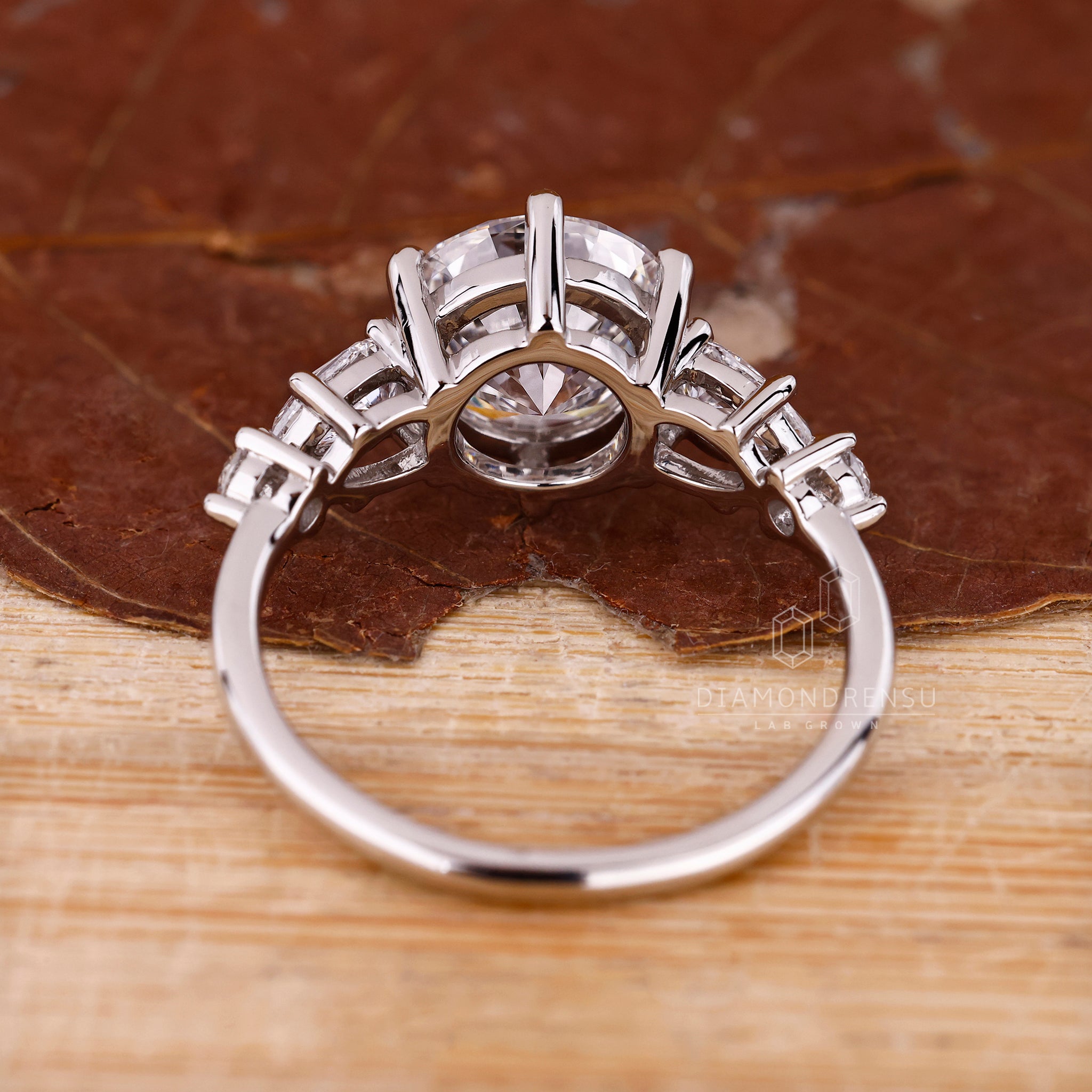 Unique ring with five diamond stones in prong setting.

