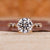 Round cut engagement ring with milgrain details.

