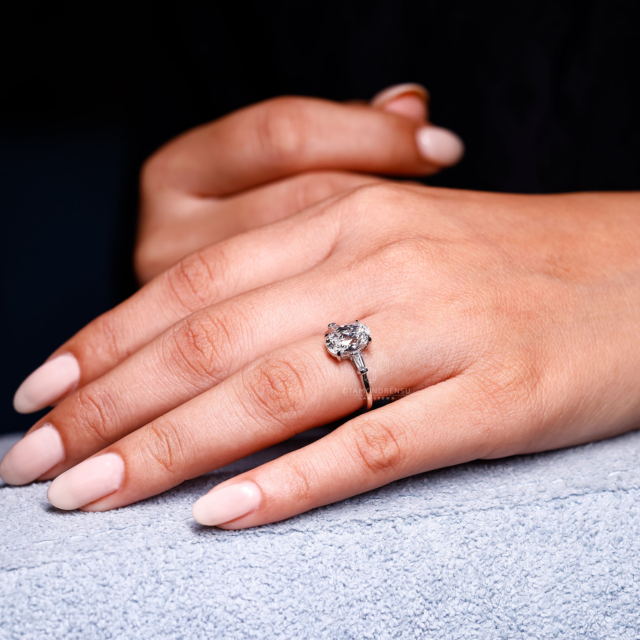 Oval old European cut diamond ring with four claw prong setting