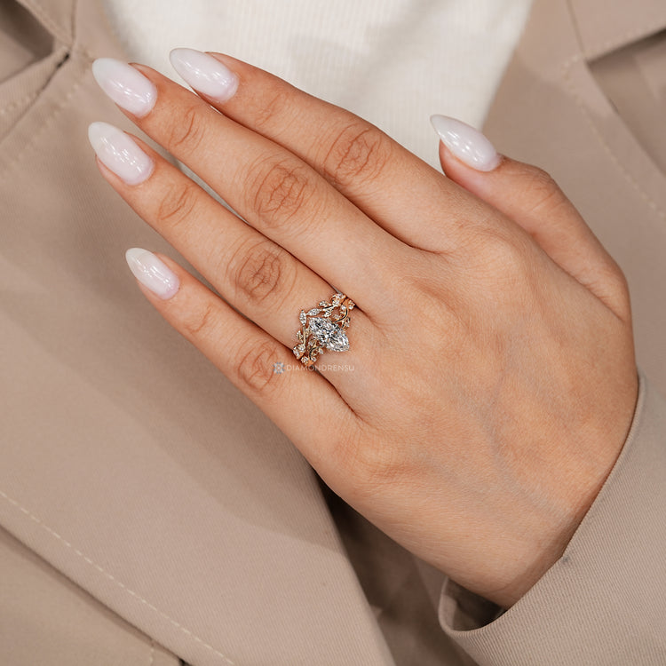 Nature inspired ring with hidden emerald and round diamonds.
