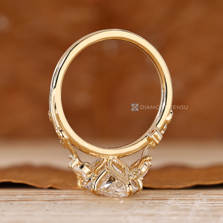 Marquise cut diamond ring with tulip setting details.