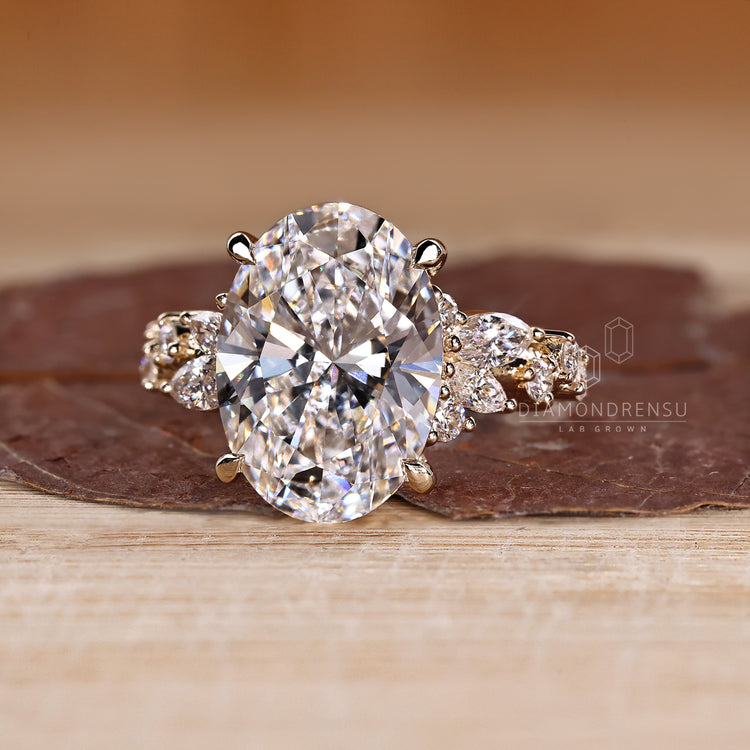 Lab grown oval diamond ring with cluster design.