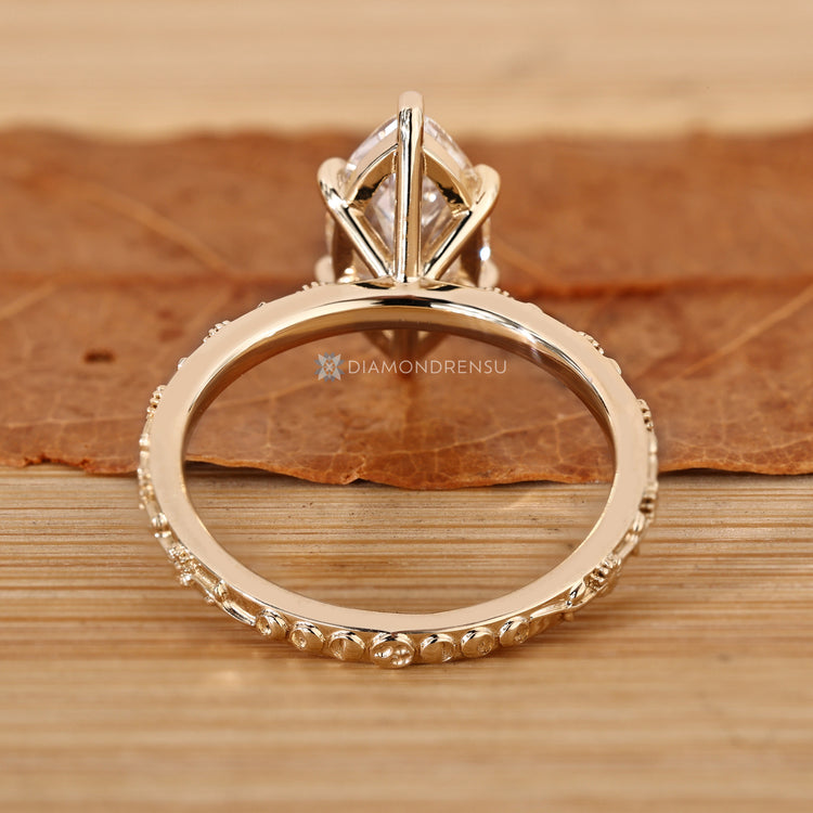 Art deco solitaire ring with marquise cut diamond.