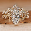 Marquise bridal set with round side stones and split shank.