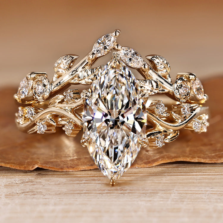 Marquise bridal set with round side stones and split shank.