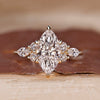 Marquise cut lab grown diamond ring with side stones.