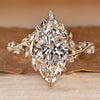 Marquise cut ring with round side stones.