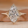 Marquise cut diamond ring with split shank design.