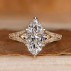 Marquise engagement ring with split shank and solitaire style.