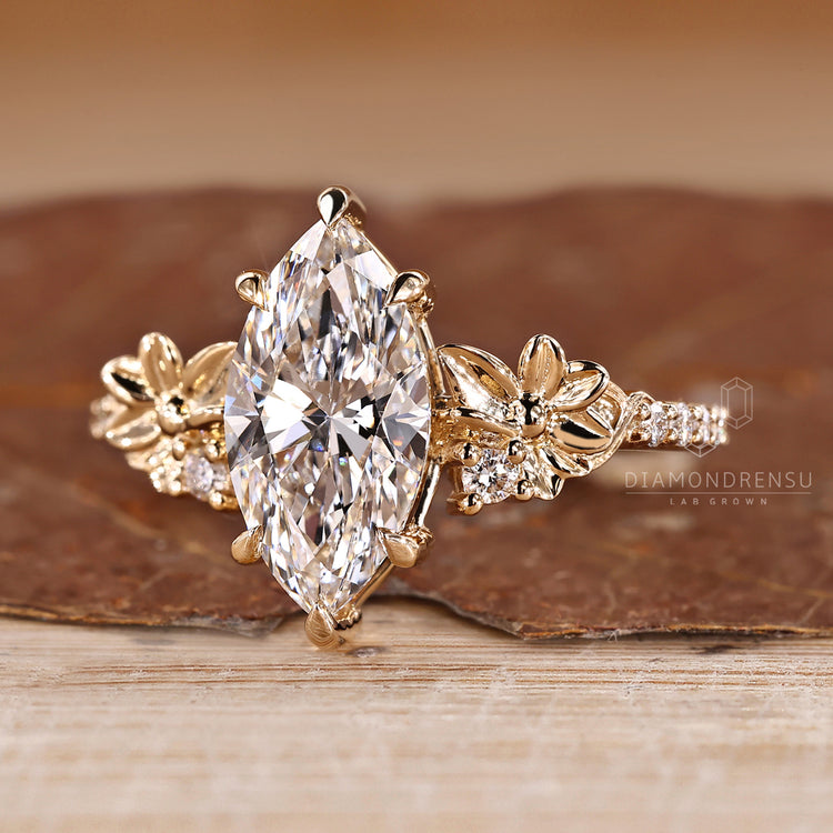 Marquise diamond ring with round cut pave band.