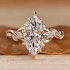 Nature inspired engagement ring with marquise centre diamond.