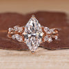Marquise cut diamond ring with round side stones