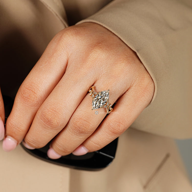 Handmade marquise diamond ring with tulip setting.