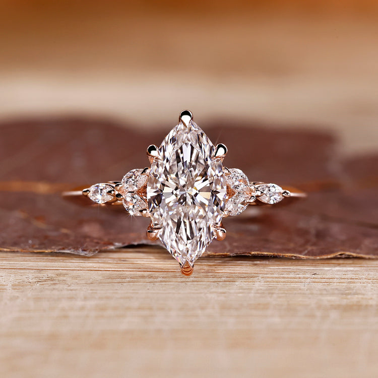 Marquise cut ring with muse setting and marquise side stones.
