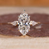 Three stone engagement ring with marquise cut centre diamond.