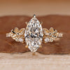 Marquise cut diamond ring with nature inspired flower design.
