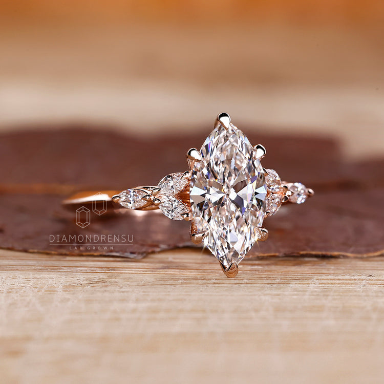 Lab grown marquise ring with knife edge shank design.
