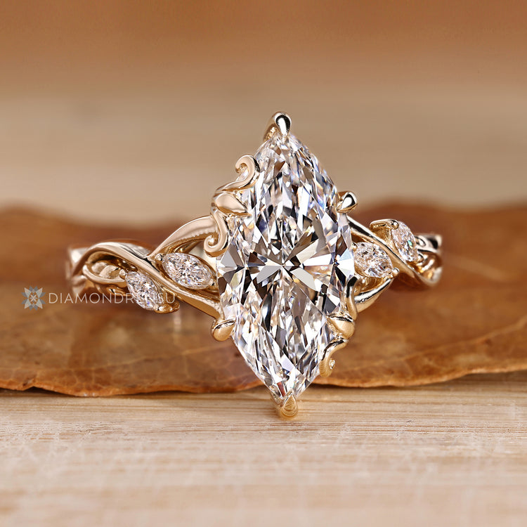 Marquise diamond ring with claw prong setting.