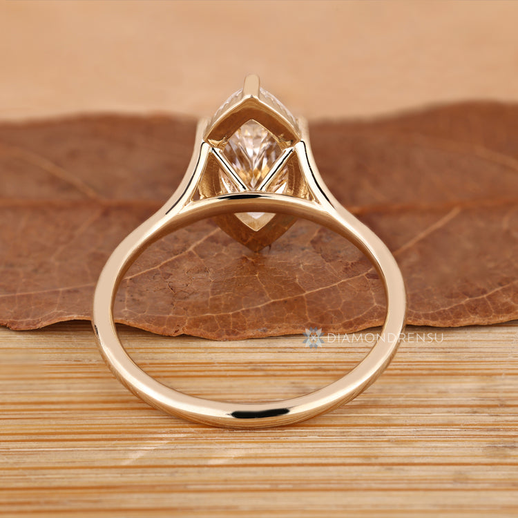 Handmade marquise solitaire ring with split shank.