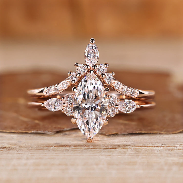 Marquise wedding ring with marquise and round side stones.