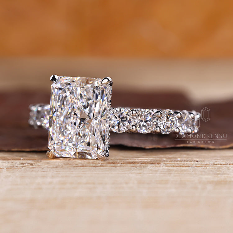 Handmade radiant diamond ring with round hidden accent stones.