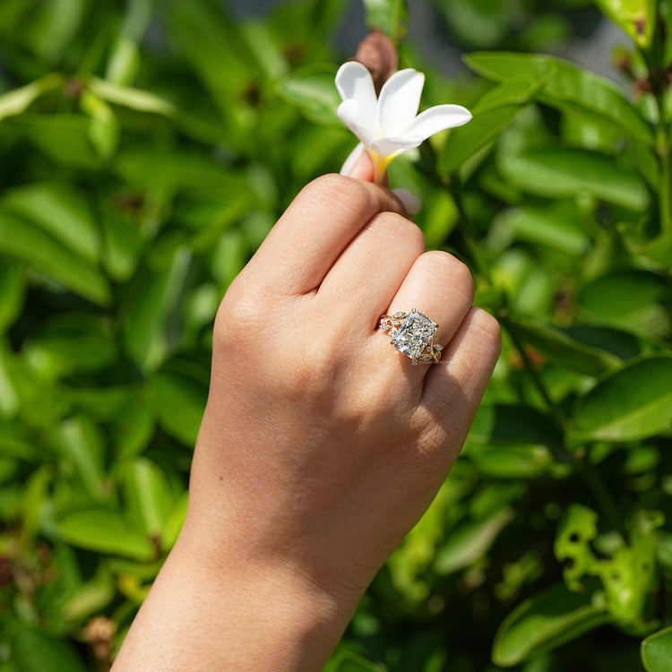 Handmade radiant diamond ring with milgrain details.