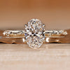 Handmade oval diamond ring with cathedral setting.
