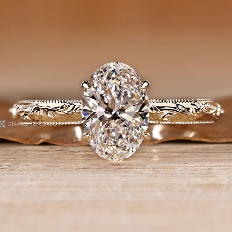 Handmade oval diamond ring with cathedral setting.