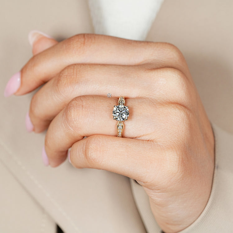 Art Deco engagement ring with pinch shank and milgrain details.