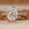 Oval cut diamond ring with art deco style and bezel setting.