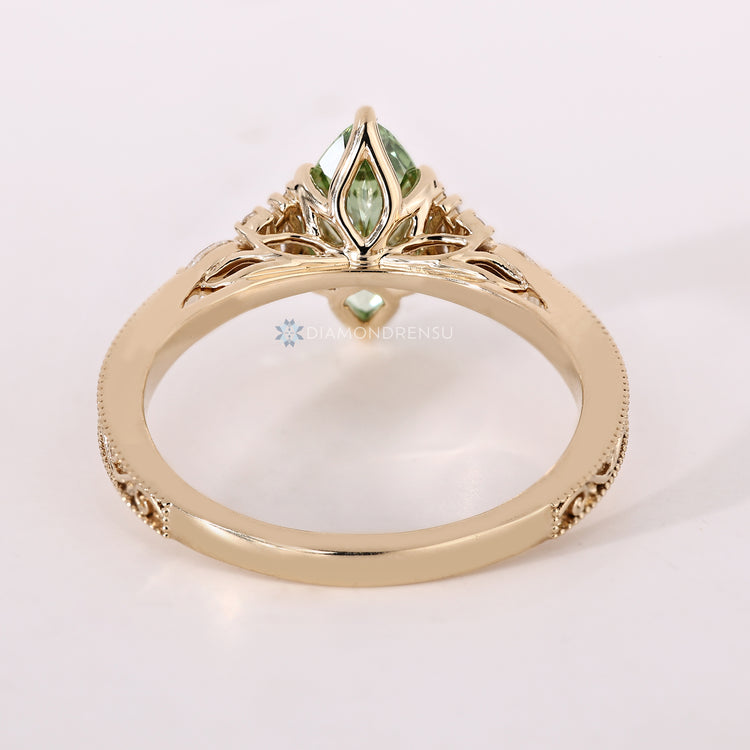 Handmade marquise ring with tulip setting and six prongs.