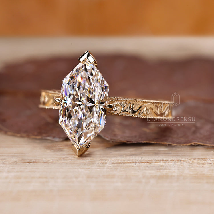 Dutch marquise diamond ring with milgrain edge and tapered shank.