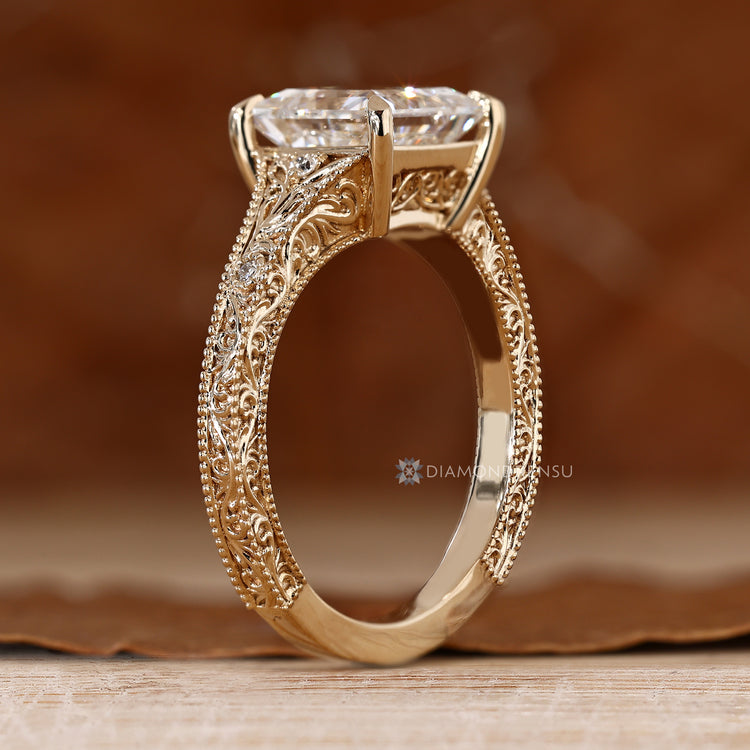 Princess cut diamond ring with four claw prong setting.