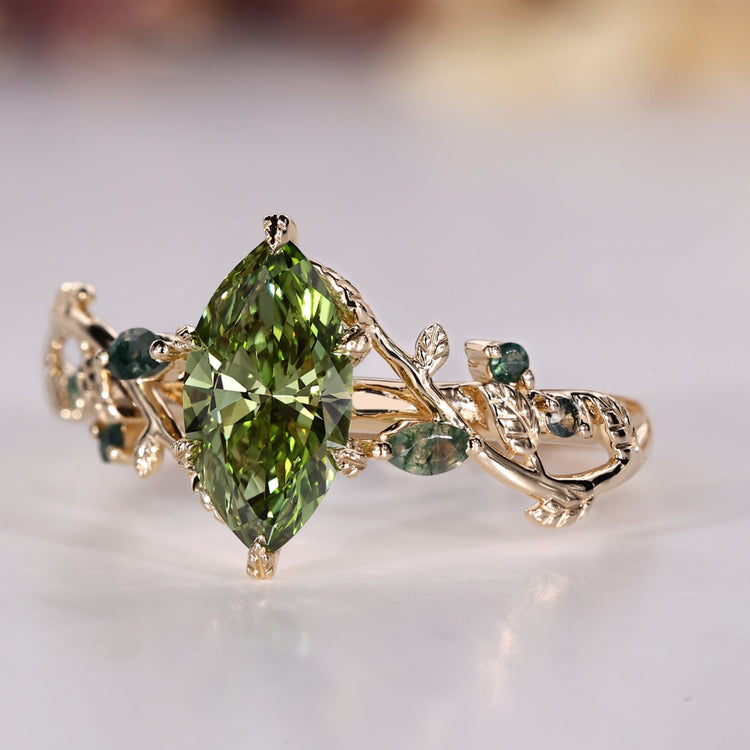 Marquise diamond ring with green centre diamond and moss agate.