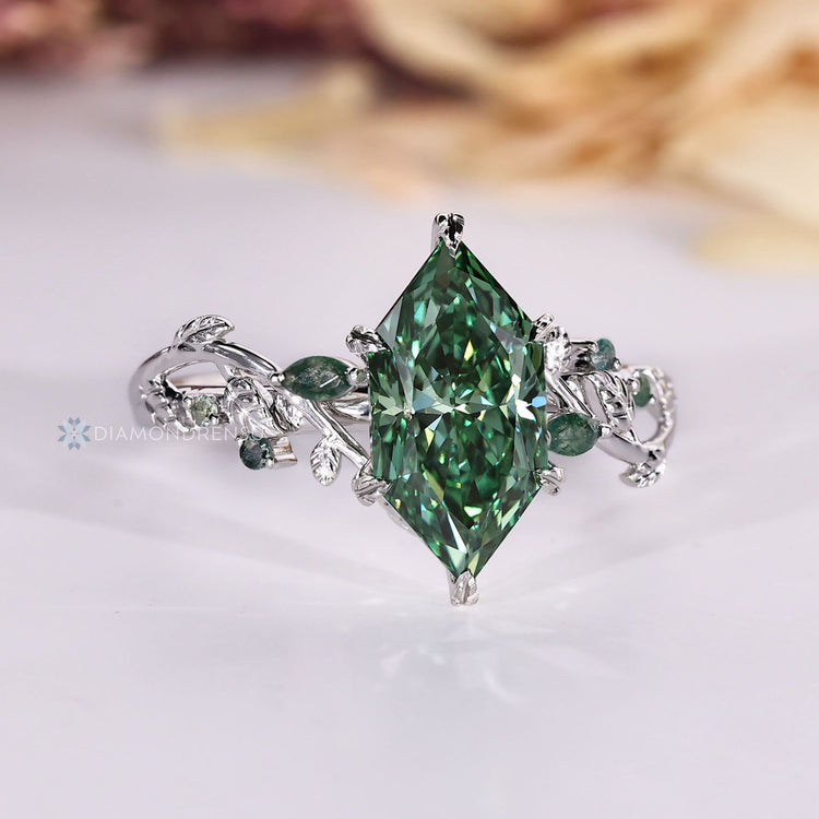 Green diamond engagement ring with nature inspired design.