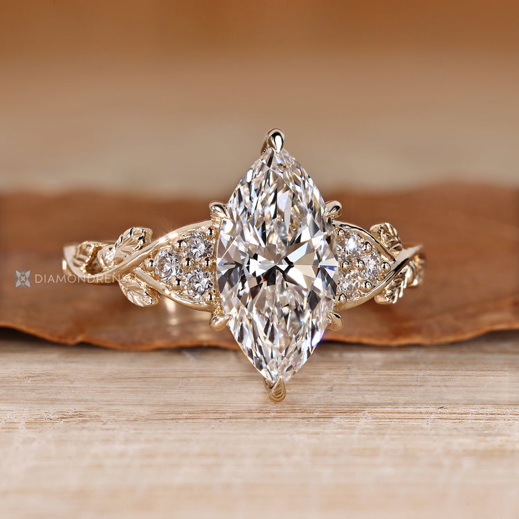 Lab grown diamond marquise ring with round side stones.