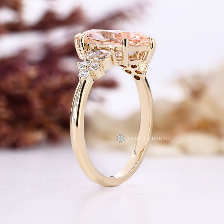 Handmade pink diamond ring with six claw prongs.