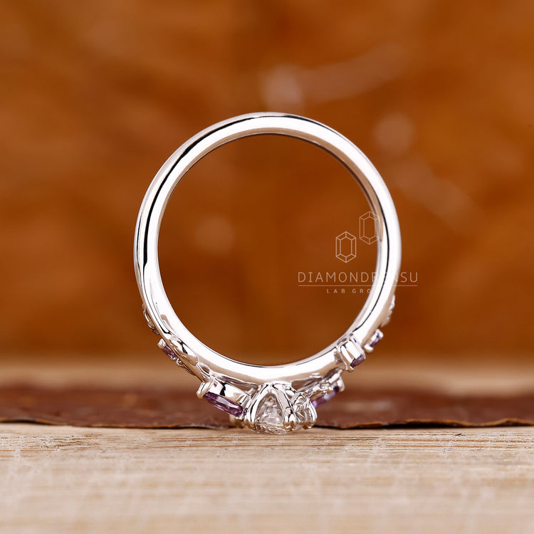 IGI certified ring with marquise diamond and gemstones.